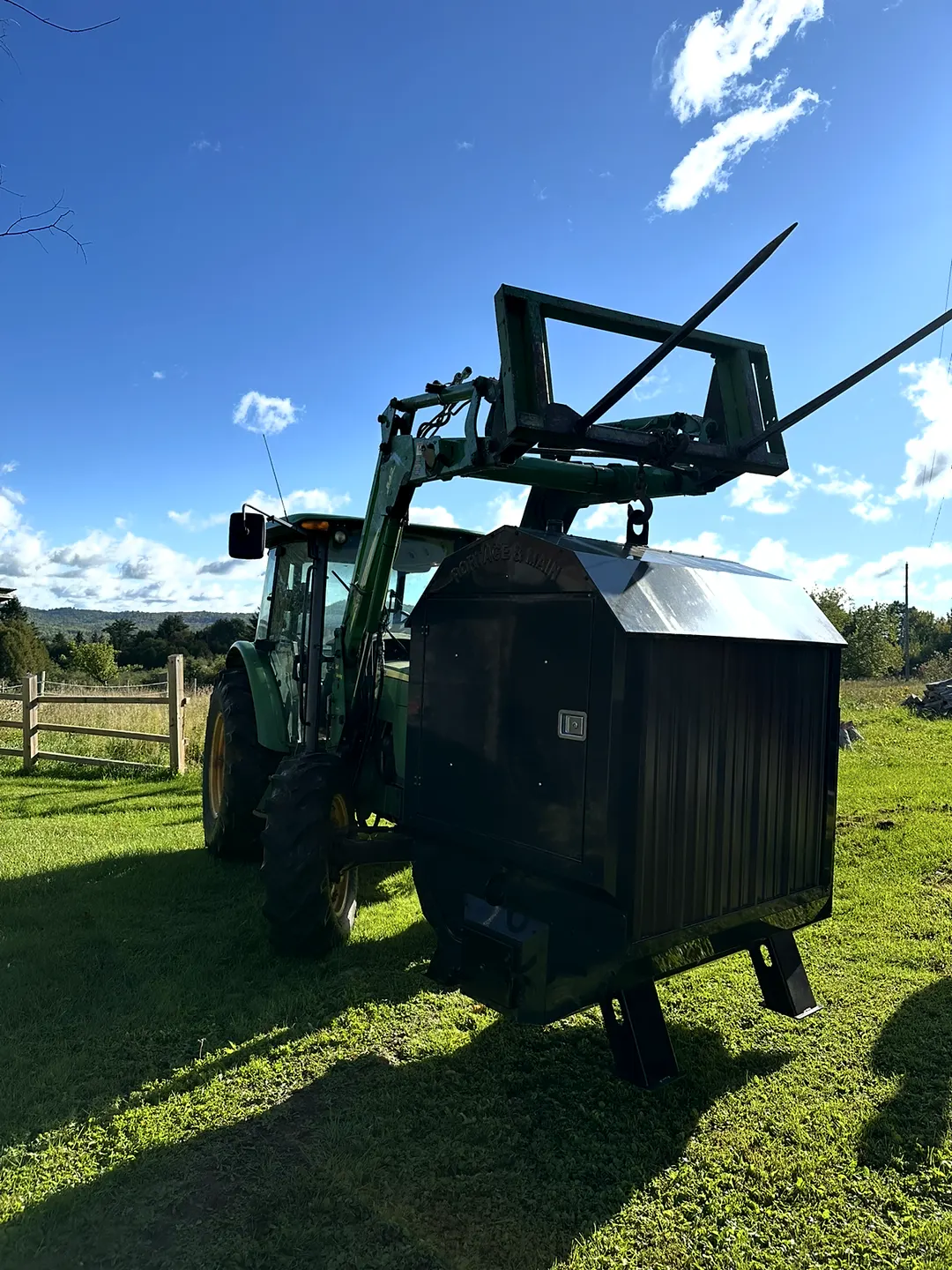 Setting a boiler in place with the tractor